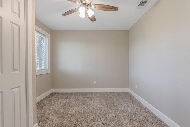 unfurnished room featuring ceiling fan and carpet flooring