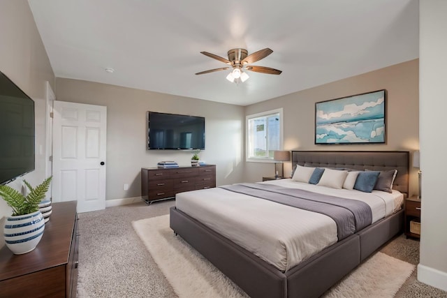 bedroom with light carpet and ceiling fan