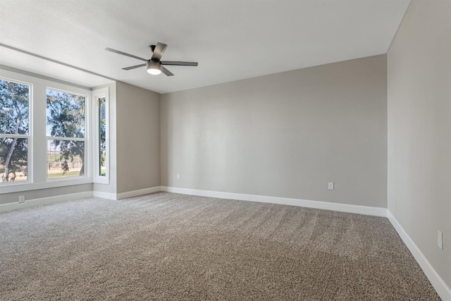 carpeted empty room with ceiling fan