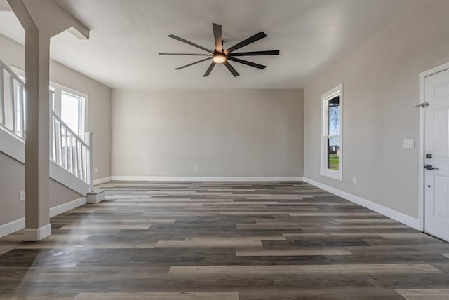 interior space with ceiling fan and dark hardwood / wood-style floors