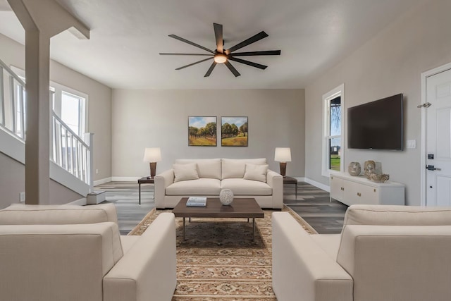 living room with hardwood / wood-style flooring and ceiling fan