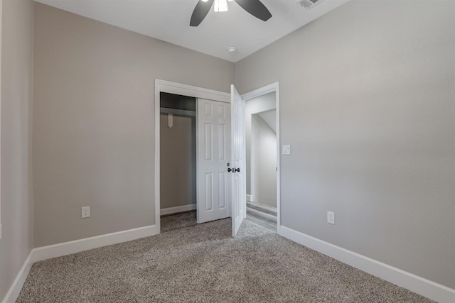 unfurnished bedroom featuring a closet, ceiling fan, and carpet