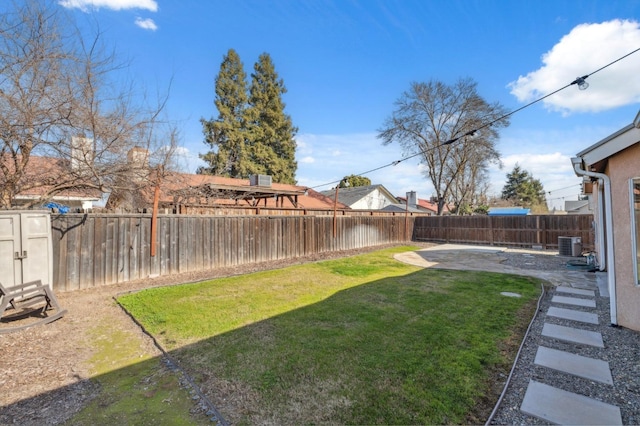 view of yard featuring cooling unit and a patio area