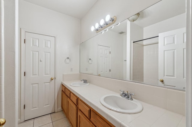 bathroom with vanity and tile patterned flooring