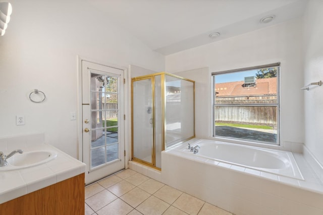 bathroom featuring vanity, separate shower and tub, and tile patterned floors