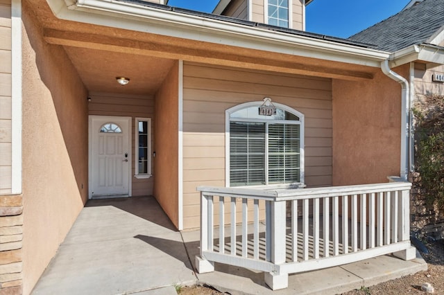 doorway to property with covered porch