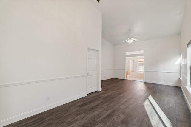 unfurnished room with lofted ceiling, dark hardwood / wood-style floors, and ceiling fan