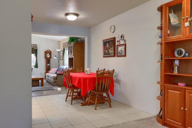 dining space with light tile patterned floors