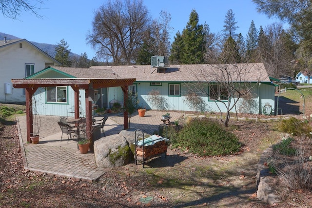 back of house with a patio, cooling unit, and a pergola