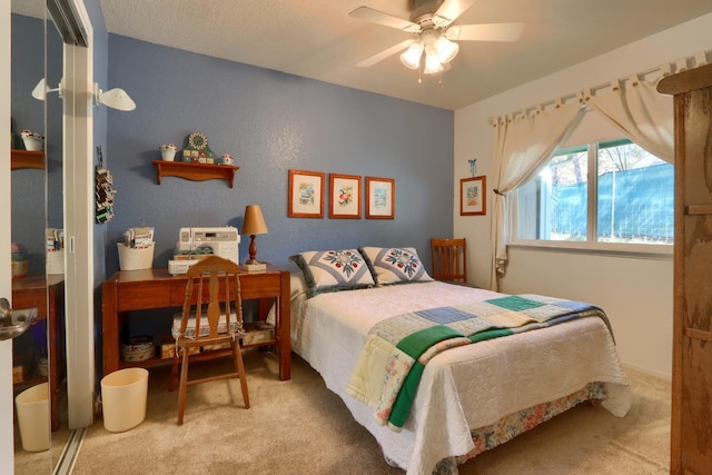 bedroom with ceiling fan and carpet flooring