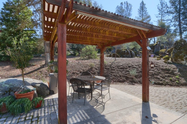 view of patio / terrace featuring outdoor dining space and a pergola