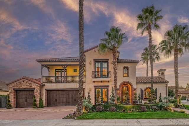 mediterranean / spanish house with a balcony