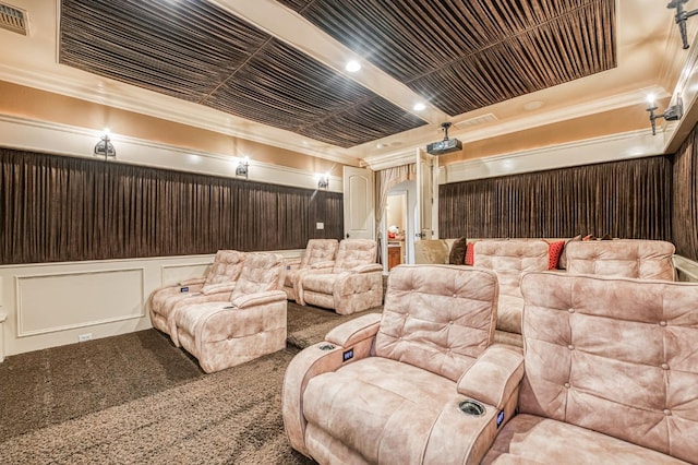 carpeted cinema room featuring wooden walls