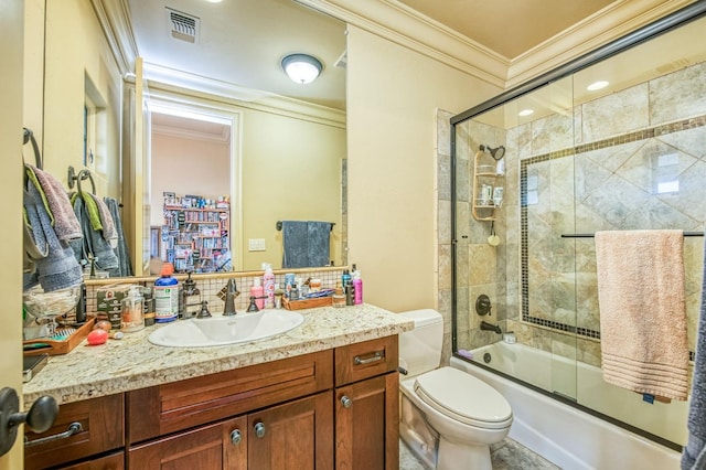 full bathroom with enclosed tub / shower combo, ornamental molding, vanity, and toilet