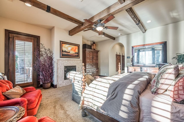 living room with beamed ceiling, light carpet, and ceiling fan