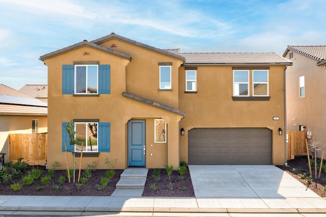 661 Lucas Ave S, Madera, CA 93636 - view of front of property with stucco siding, fence, a garage, and concrete driveway
