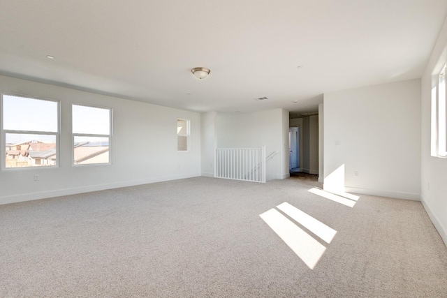 661 Lucas Ave S, Madera, CA 93636 - spare room with light carpet, baseboards, and visible vents