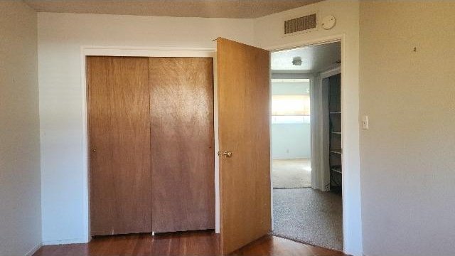 hallway featuring dark wood-type flooring