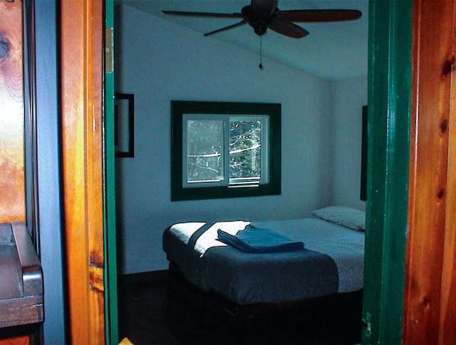 bedroom with ceiling fan and vaulted ceiling