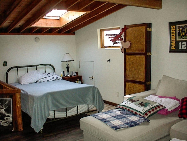 bedroom with vaulted ceiling with beams and dark wood-type flooring