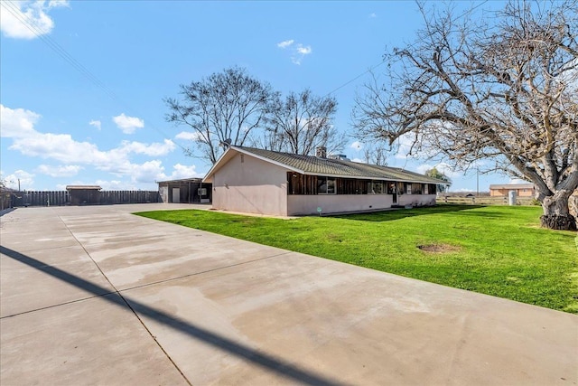 view of property exterior with a yard