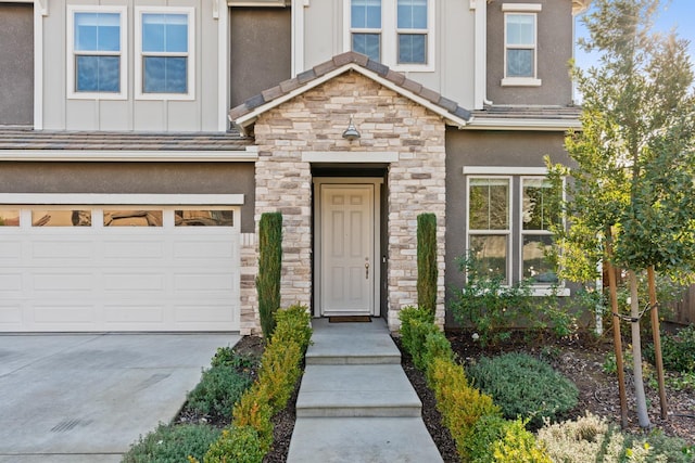 entrance to property featuring a garage