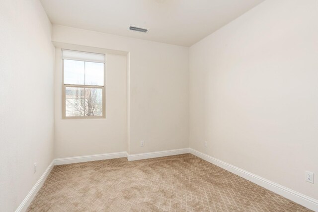 unfurnished room featuring carpet flooring