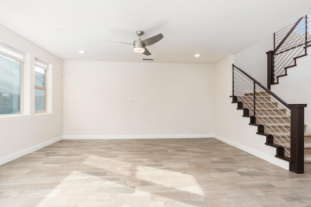 spare room featuring ceiling fan and light hardwood / wood-style flooring