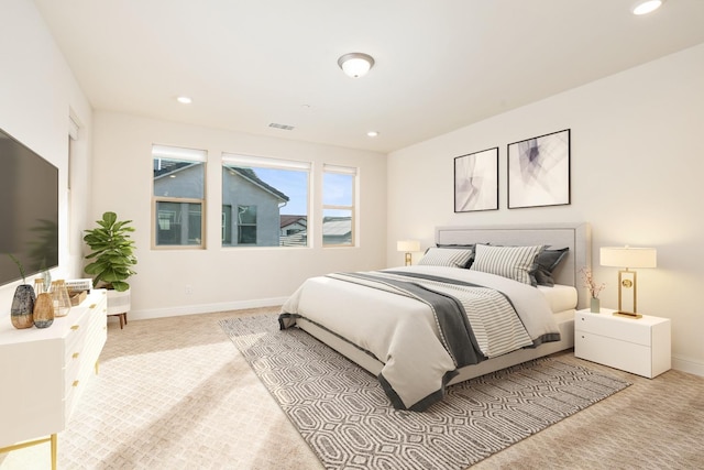 bedroom with light colored carpet