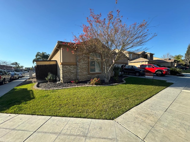 view of property exterior featuring a lawn