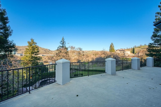 view of gate with a mountain view