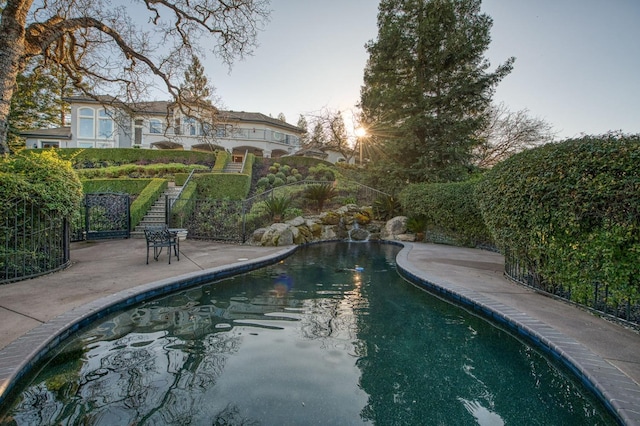 view of swimming pool featuring a patio