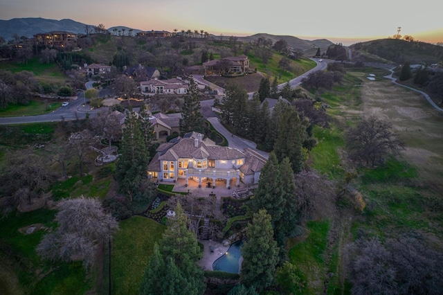 aerial view at dusk with a mountain view