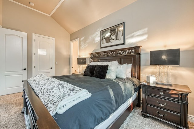 bedroom with lofted ceiling and light carpet