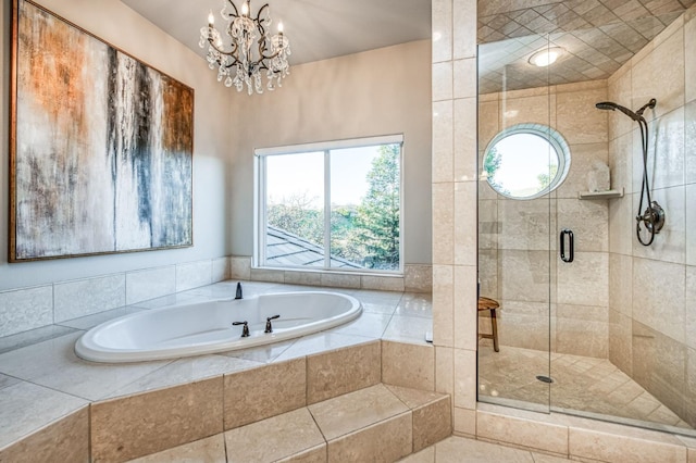 bathroom with plus walk in shower and an inviting chandelier