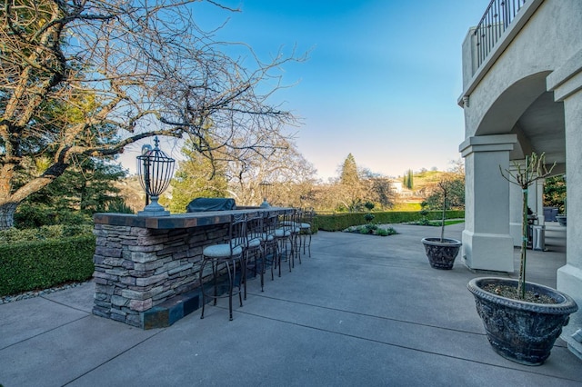 view of patio with exterior bar