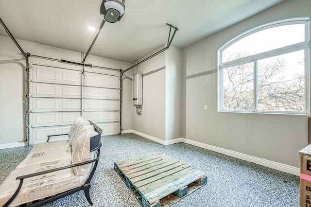 garage with a garage door opener and water heater