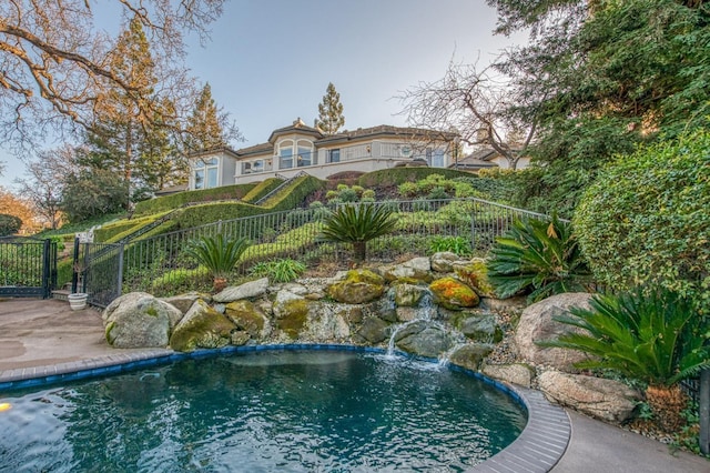 view of pool featuring pool water feature