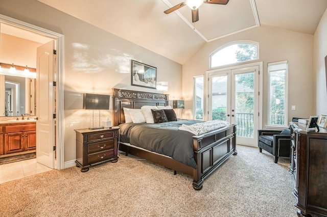 bedroom with lofted ceiling, sink, access to exterior, light carpet, and french doors