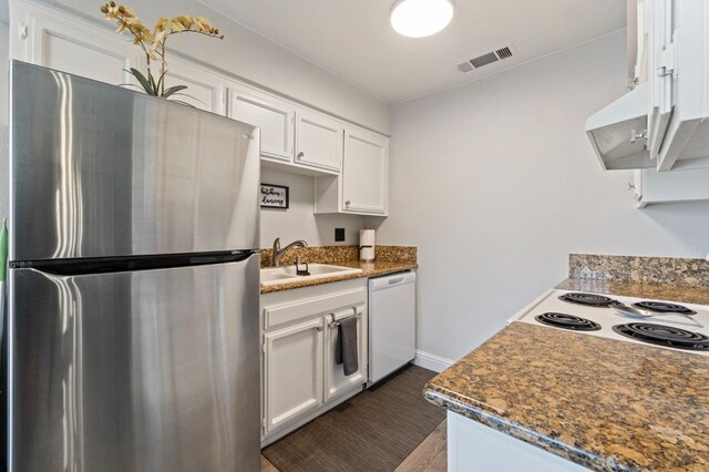 kitchen with white cabinetry, stainless steel fridge, dishwasher, and sink