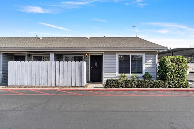 view of front of property with roof with shingles