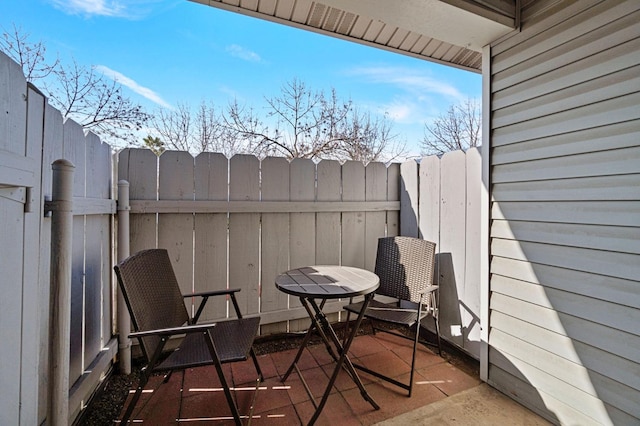 view of patio featuring fence