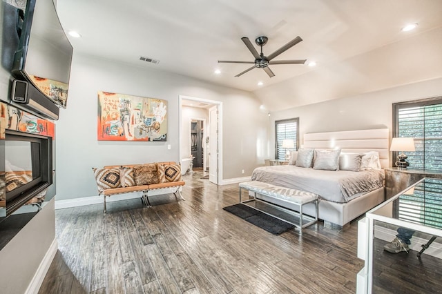 bedroom featuring ceiling fan, lofted ceiling, and dark hardwood / wood-style flooring