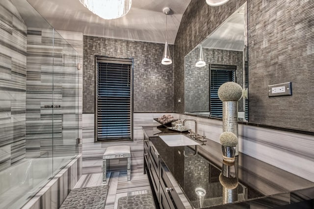 bathroom with vanity, shower / bath combination, tile patterned flooring, and tile walls