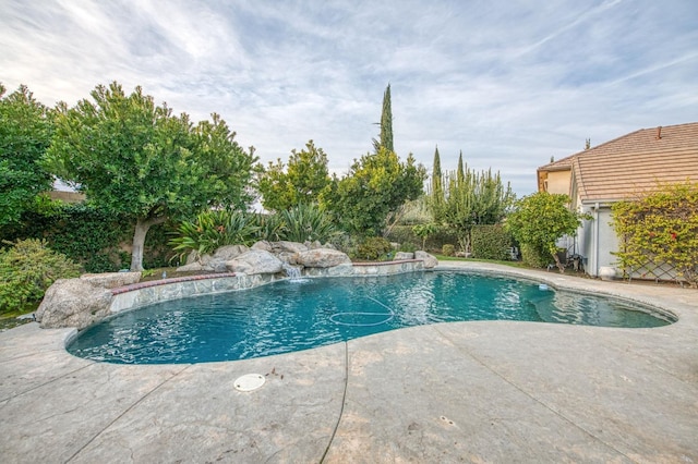 view of swimming pool featuring a patio and pool water feature