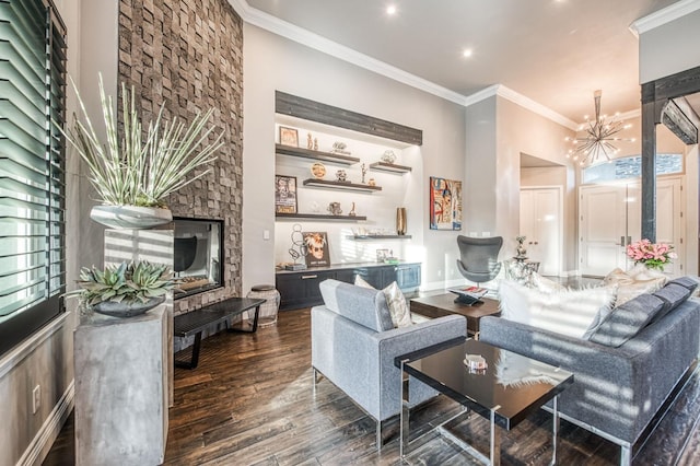 interior space featuring ornamental molding, dark hardwood / wood-style floors, a chandelier, and a wealth of natural light