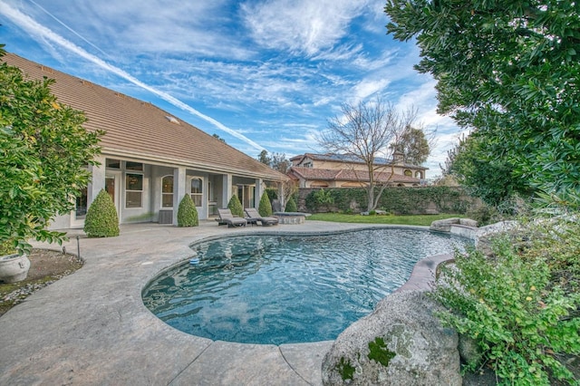 view of swimming pool with a patio