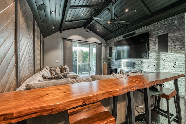 bar with vaulted ceiling with beams, wooden ceiling, and ceiling fan