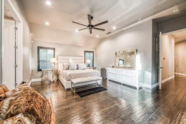 bedroom with vaulted ceiling, dark wood-type flooring, and ceiling fan