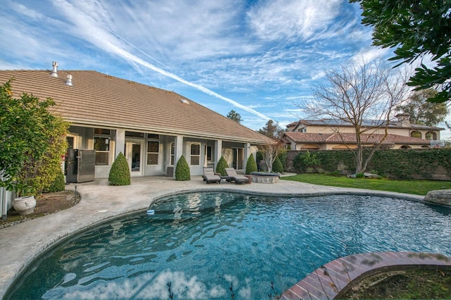 view of pool featuring a patio area and an outdoor fire pit